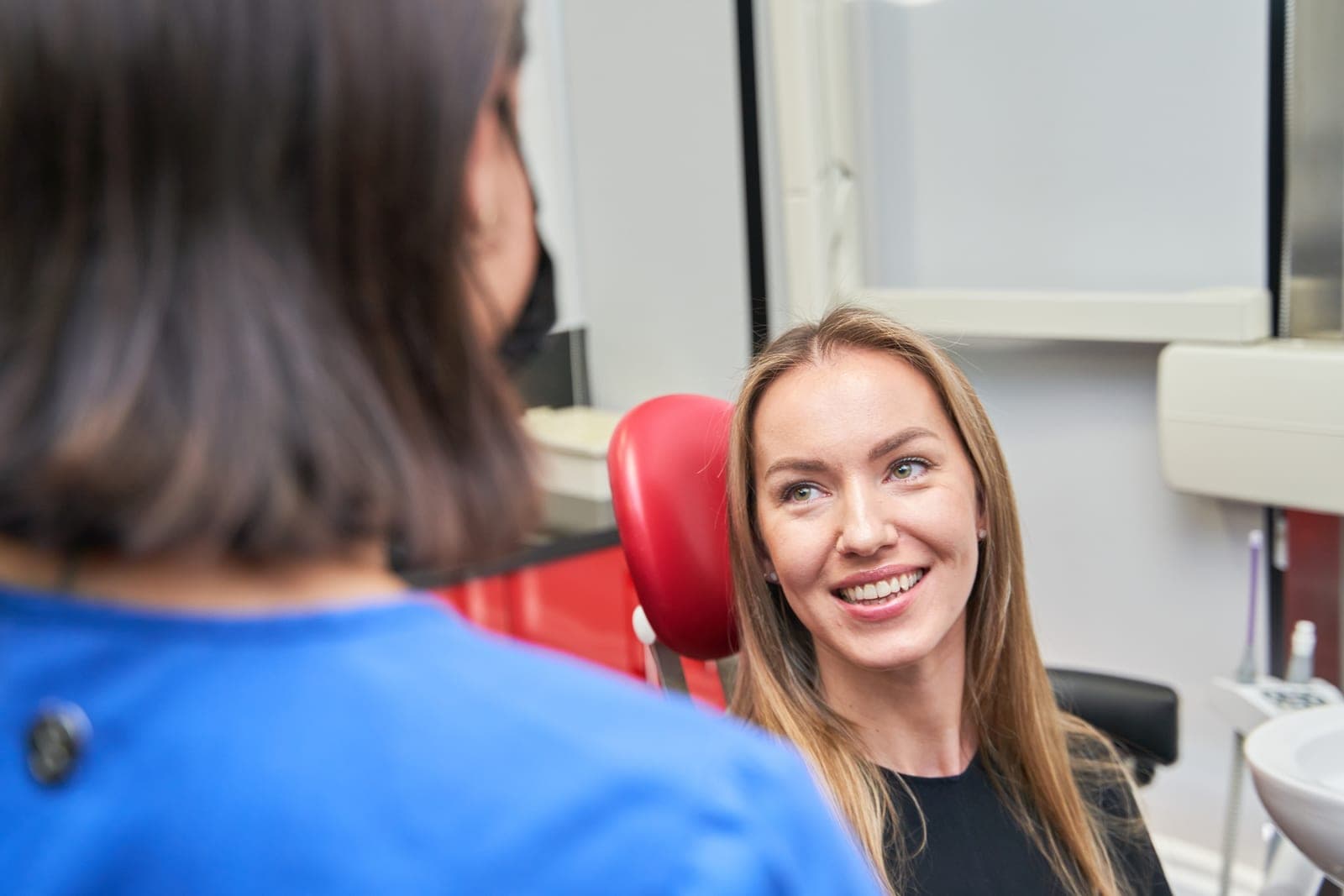 A dentist talking a patient through a gentle check-up at Brewery Yard Dental Surgery